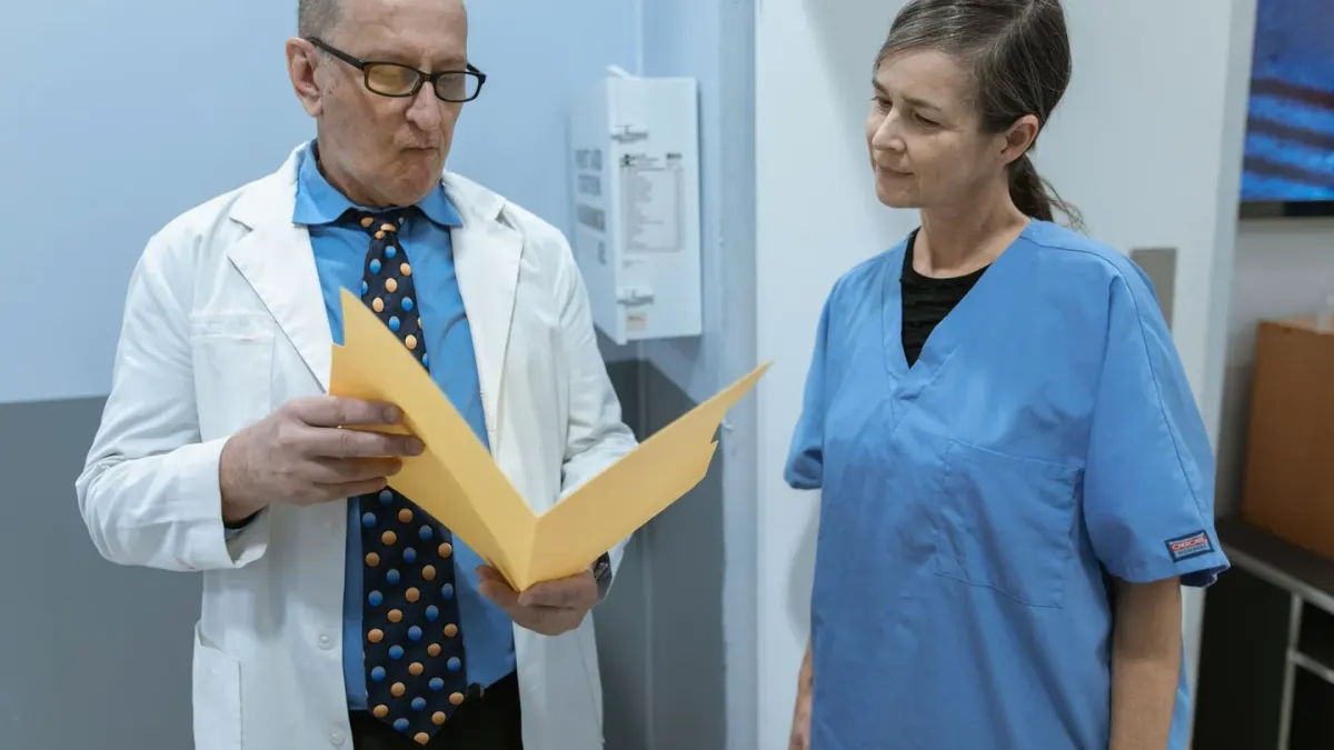 A veterinarian and dog owner reading a supplement label together at a clinic counter