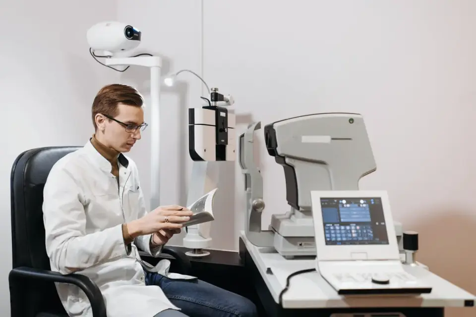 A veterinarian reviewing a supplement label with a senior dog on the exam table