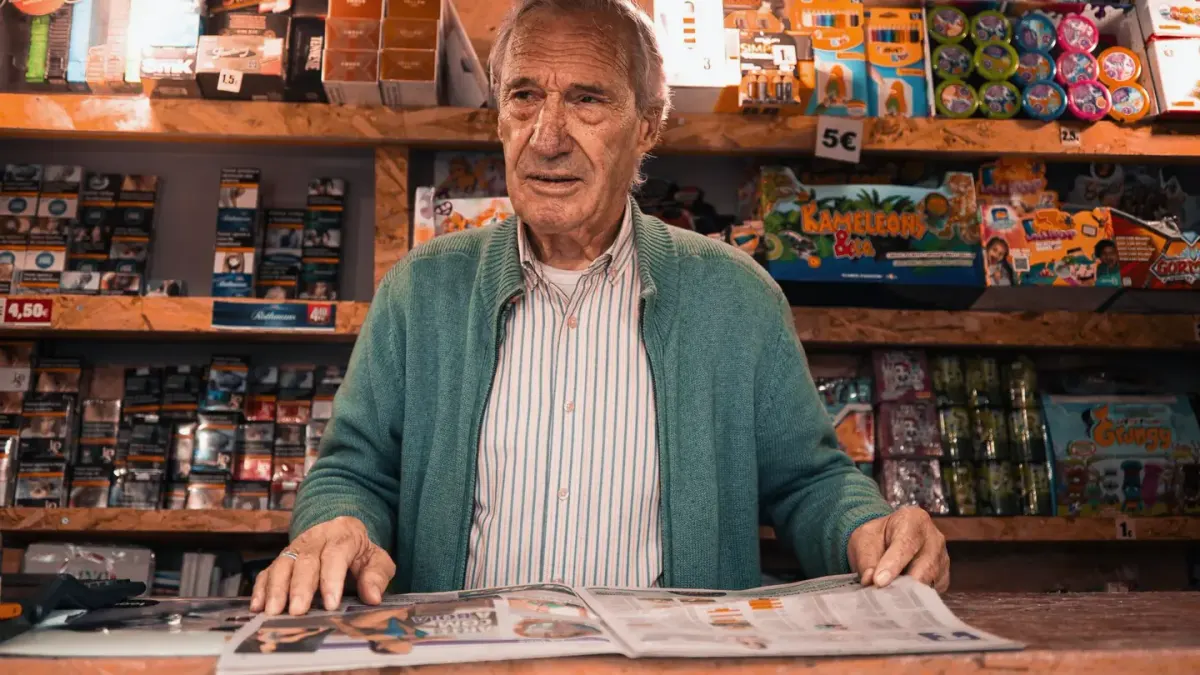 An owner reading the ingredient label on a dog supplement bottle at a kitchen counter