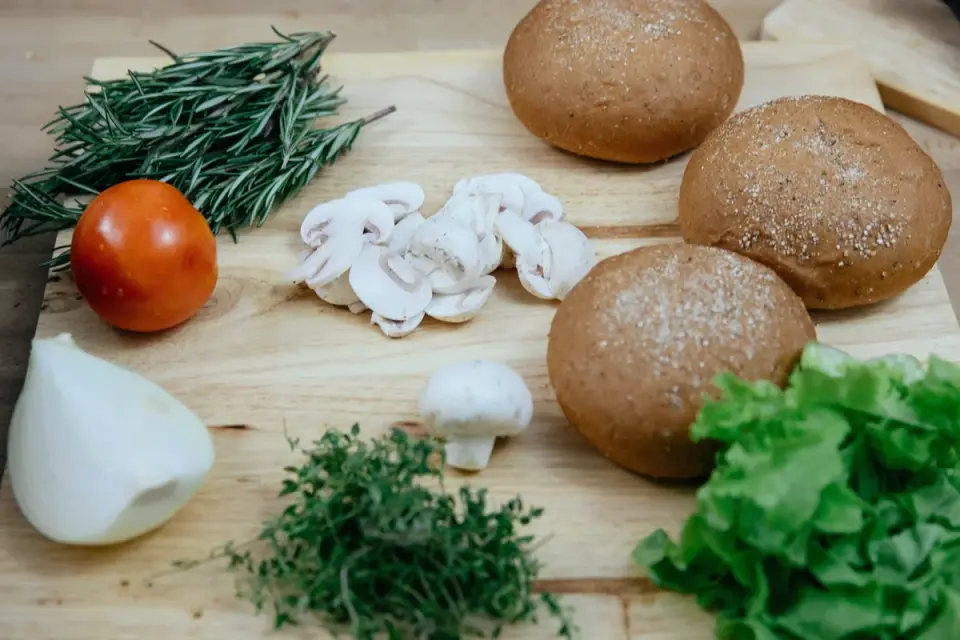 Plain chopped mushrooms on a wooden cutting board