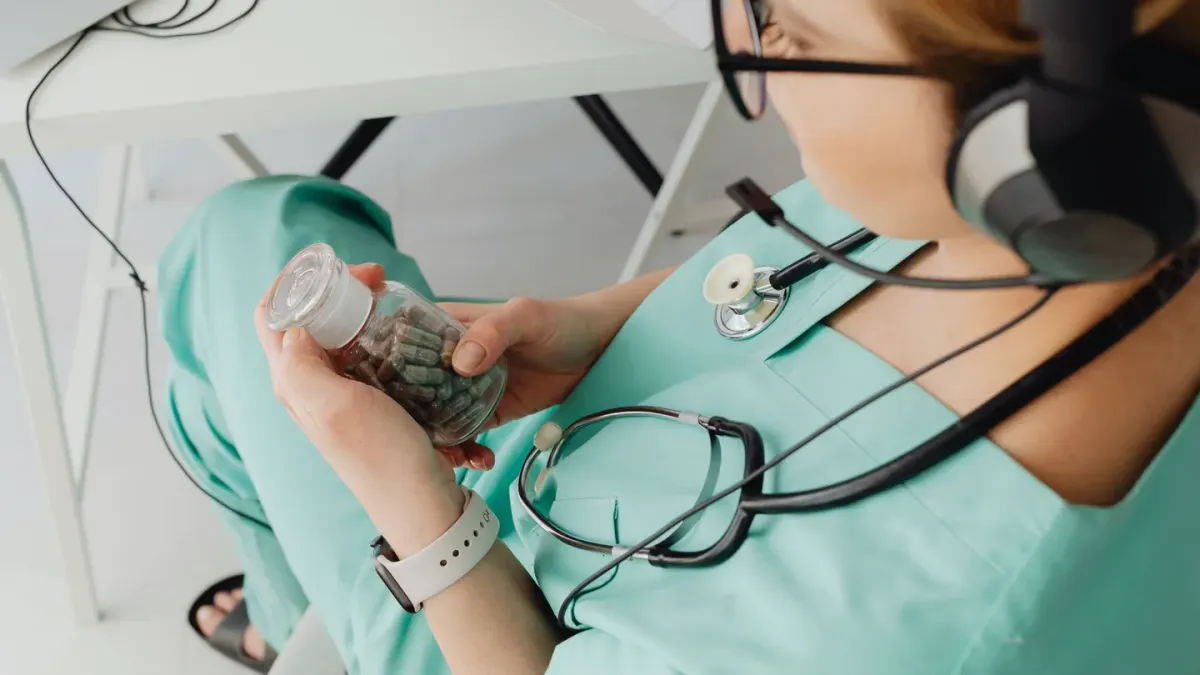 Veterinarian examining a dog supplement label closely in an exam room